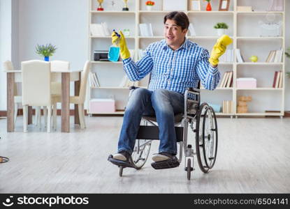 Disabled man on wheelchair cleaning home