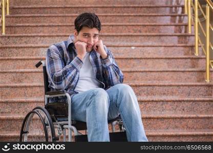 Disabled man on wheelchair having trouble with stairs