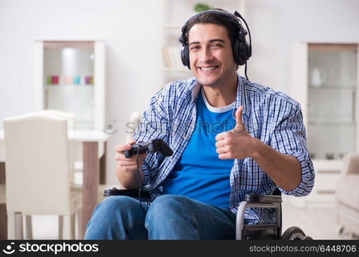 Disabled man playing computer games during rehabilitation