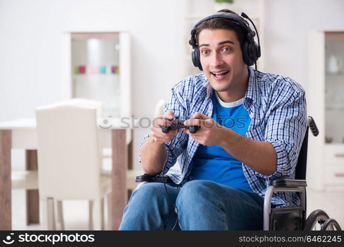 Disabled man playing computer games during rehabilitation