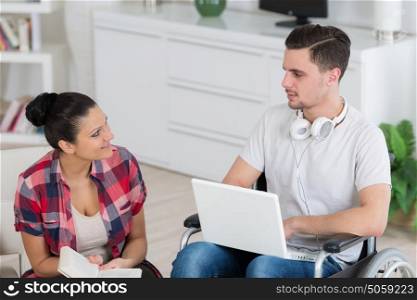 disabled man relaxing with is girlfriend at home
