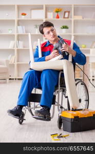 Disabled man repairing chair in workshop