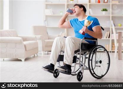 Disabled man watching sports on tv