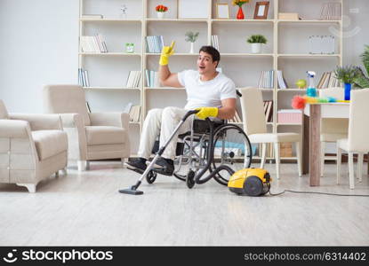 Disabled man with vacuum cleaner at home