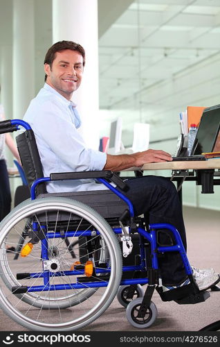 Disabled office worker using a laptop