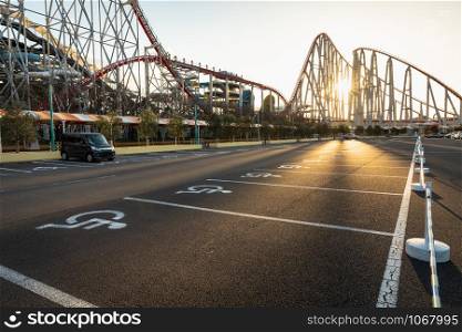disabled parking in amusement park and over the sunset background evening time in japan