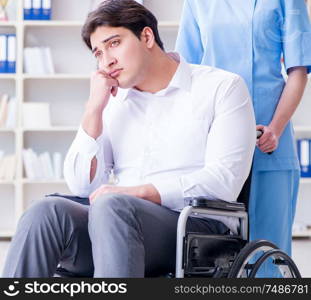 Disabled patient on wheelchair visiting doctor for regular check up. Disabled patient on wheelchair visiting doctor for regular check
