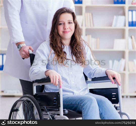 Disabled patient on wheelchair visiting doctor for regular check up. Disabled patient on wheelchair visiting doctor for regular check
