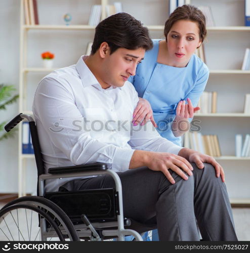 Disabled patient on wheelchair visiting doctor for regular check up. Disabled patient on wheelchair visiting doctor for regular check