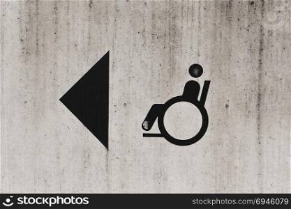 Disabled Person Sign on the concrete wall
