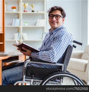 Disabled student studying at home on wheelchair. The disabled student studying at home on wheelchair