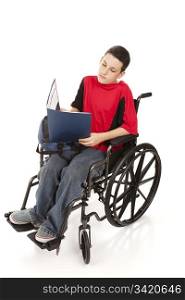 Disabled teen boy doing homework in his wheelchair. Full body isolated on white.