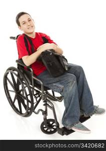 Disabled teen boy in his wheelchair with his backpack. Full body isolted on white.