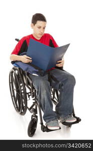 Disabled teen school boy reading in his wheelchair. Full body isolated.