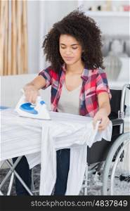 disabled woman doing some ironing