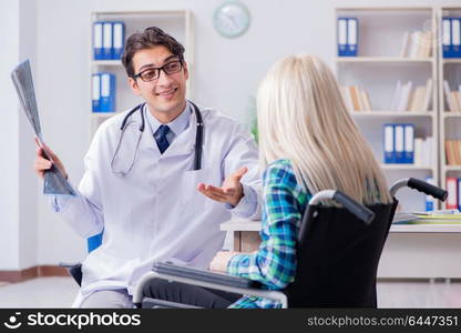 Disabled woman in wheel chair visiting man doctor