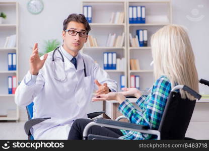 Disabled woman in wheel chair visiting man doctor