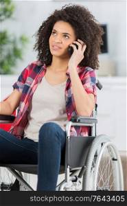 disabled woman in wheelchair making call