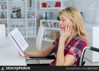 Disabled woman reading a novel