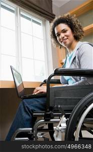 Disabled woman using a laptop computer