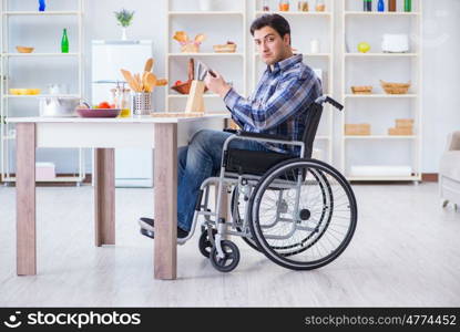 Disabled young man husband working in kitchen