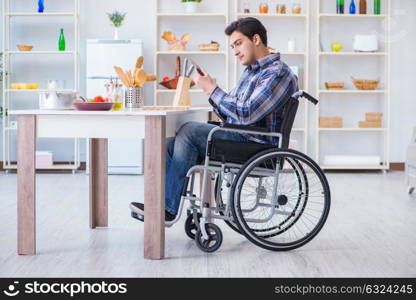 Disabled young man husband working in kitchen