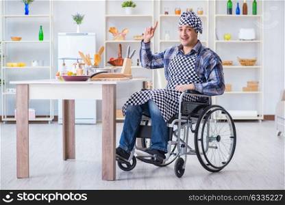 Disabled young man husband working in kitchen