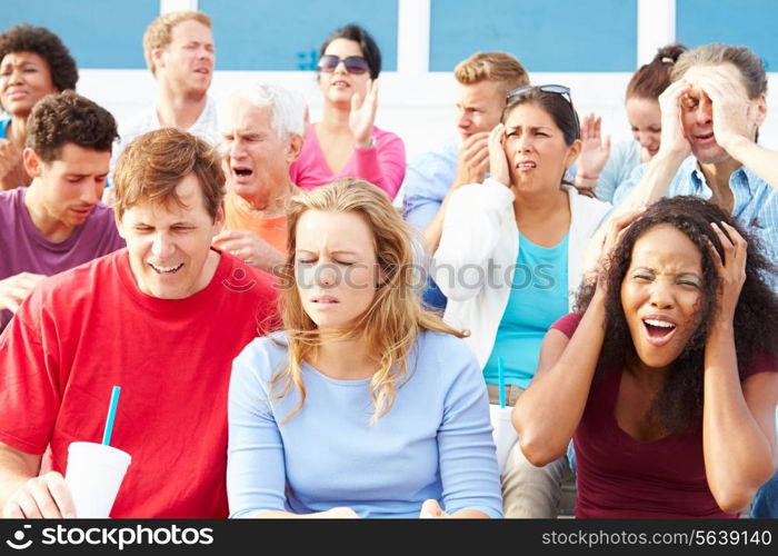 Disappointed Spectators At Outdoor Sports Event