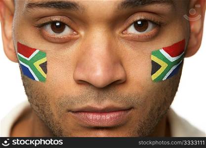 Disappointed Young Male Sports Fan With South African Flag Painted On Face
