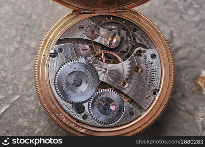 disassembled wrist watch lies on table