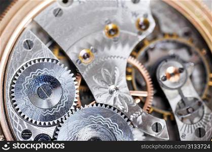 disassembled wrist watch lies on table