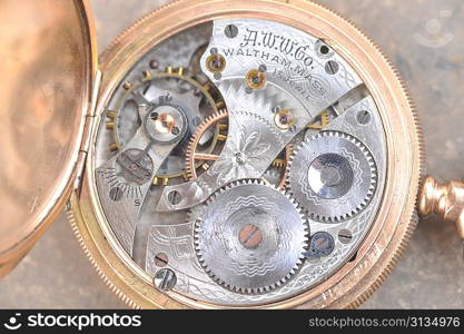 disassembled wrist watch lies on table