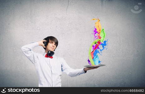 Disco party. Young handsome man with disco plate in hands