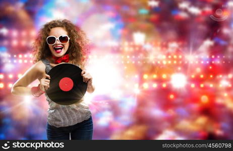 Disco party. Young pretty girl dj at disco party holding vinyl