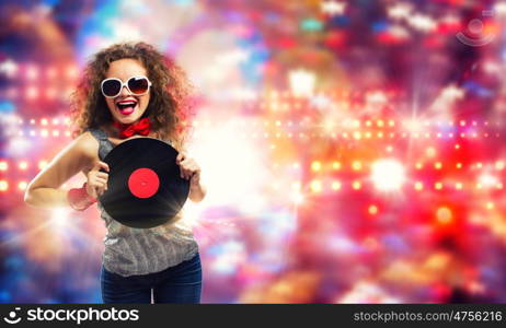 Disco party. Young pretty girl dj at disco party holding vinyl