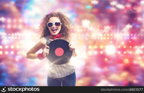 Disco party. Young pretty girl dj at disco party holding vinyl