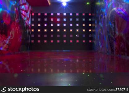 Disco with colorful lights. Dancing