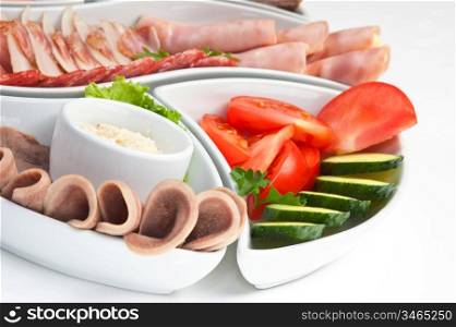 dish of assorted sausages and vegetables