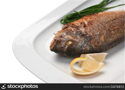 dish of fried fish with onions isolated on white background
