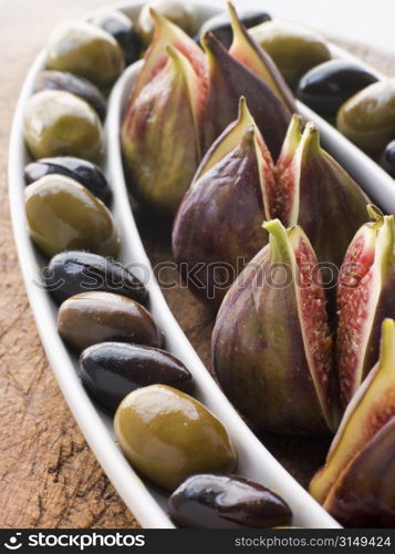 Dish of Green and Black Olives with Fresh Figs