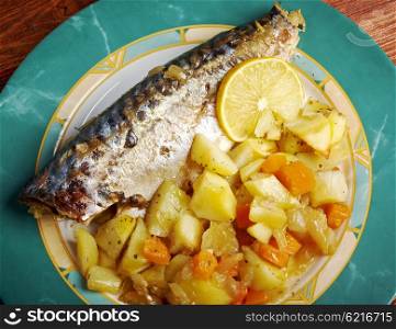Dish of grilled mackerel and potatoes . closeup