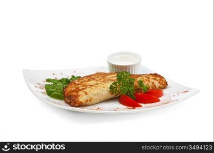 dish of pancakes with vegetables isolated on a white background