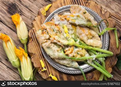 Dish of Zucchini flowers. Edible zucchini flower stuffed with soft cheese with herb