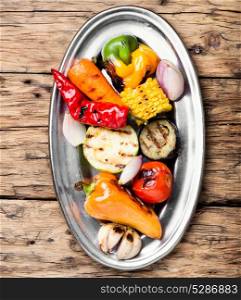 dish with grilled vegetables. grilled vegetables on a fashionable metal plate