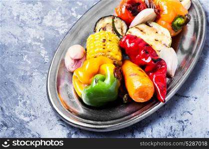 dish with grilled vegetables. grilled vegetables on a fashionable metal plate