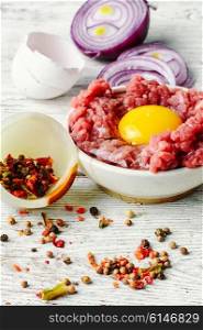 dish with raw minced beef with egg yolk and spice. Raw minced beef