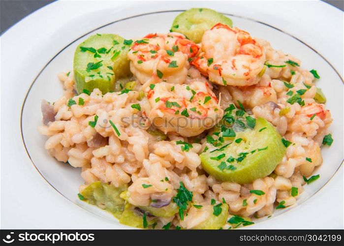 dish with risotto with prawns and zucchini