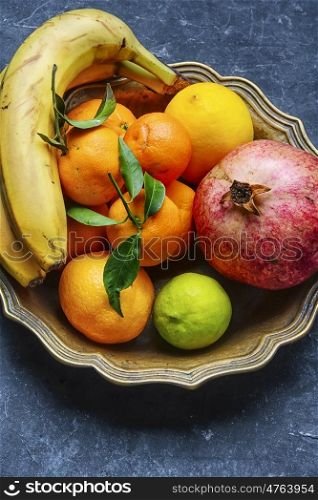 Dish with tropical fruits and citrus