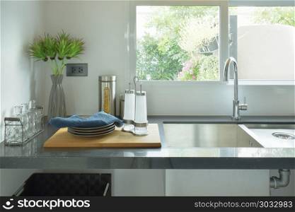 Dishes next to sink in the kitchen