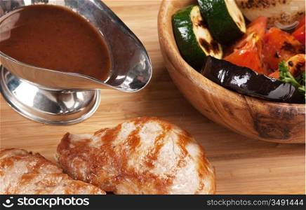 dishes of roast meat with vegetables and spices